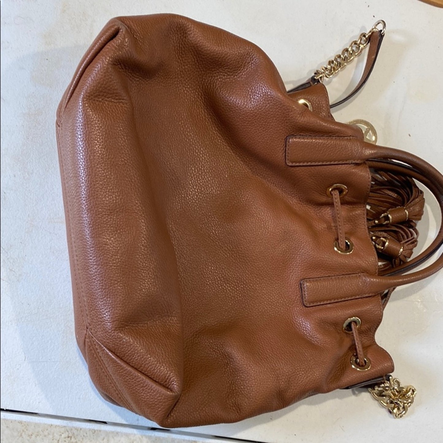 Michael Kors Brown Shoulder Bag with Tassel and Drawstring Accents